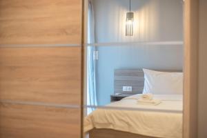 Postel nebo postele na pokoji v ubytování Modern Apartment