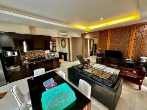 a living room with a couch and a table at VEI Haus - 4BR Pet Friendly Villa in Vimalla Hills in Gadok 1