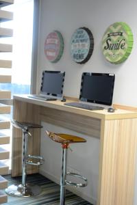 TV o dispositivi per l'intrattenimento presso Hôtel Lodge In Paris 13