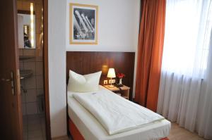 Cama ou camas em um quarto em Hotel Italia