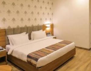 Ένα ή περισσότερα κρεβάτια σε δωμάτιο στο Comfort Inn Elite