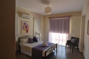 Postel nebo postele na pokoji v ubytování Aphrodite Sands Resort