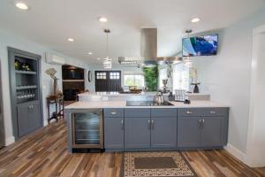 a kitchen with blue cabinets and a sink at Private Family Home With Gorgeous Yard in Camas