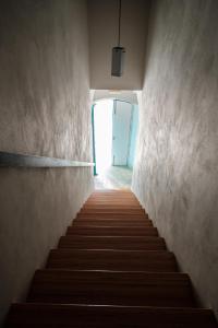a staircase leading up to a door with a stair case at B&B Fermata 106 da Carolina in Siculiana Marina