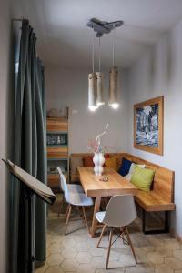 a dining room with a wooden table and chairs at B&B Fermata 106 da Carolina in Siculiana Marina