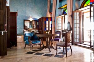 a dining room with a table and chairs at Emerson Spice in Zanzibar City