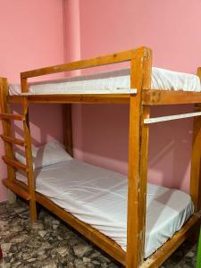 a couple of bunk beds in a room at Zia's Homestay in Siquijor