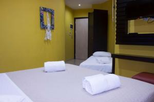 Postel nebo postele na pokoji v ubytování INOH HOTEL