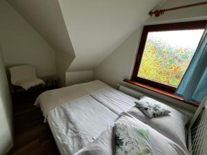 Postel nebo postele na pokoji v ubytování Domek w Szczyrku + 7 fotografií