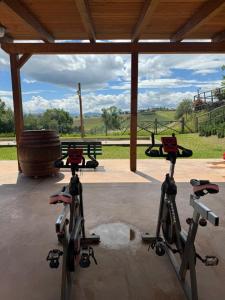 a group of three exercise bikes parked in a pavilion at Montenovo Country House in Ostra Vetere