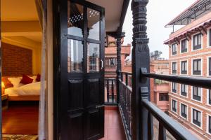 Postel nebo postele na pokoji v ubytování vajra house