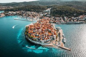 an aerial view of a small island in the water at SEA HOUSE mobile home, pool, bikes, SUP - PRIVILEGE POINT camping & villas in Orebić