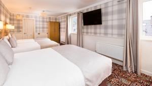 Krevet ili kreveti u jedinici u okviru objekta Fisher's Hotel