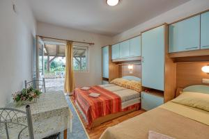 Postel nebo postele na pokoji v ubytování Apartment Basic