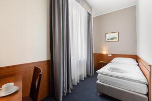 Posteľ alebo postele v izbe v ubytovaní Hotel Beránek