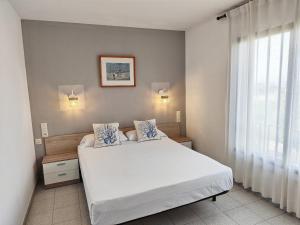a bedroom with a white bed and a window at Hotel San Martin in Altafulla +68 photos