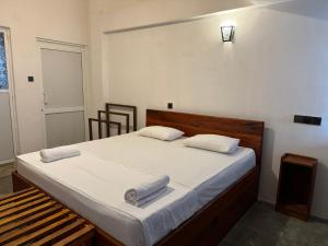 Postel nebo postele na pokoji v ubytování Sky Heaven Hotel