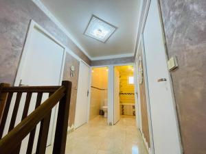 a staircase leading to a bathroom with a toilet at Maison Familiale avec Jardin in Ozoir-la-Ferrière +19 photos