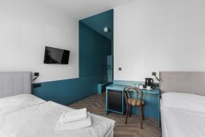 Posteľ alebo postele v izbe v ubytovaní Hotel Beránek