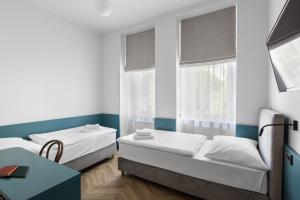 Posteľ alebo postele v izbe v ubytovaní Hotel Beránek