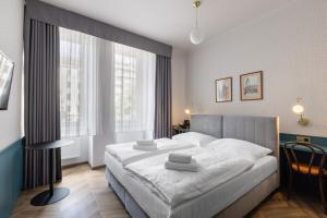 Posteľ alebo postele v izbe v ubytovaní Hotel Beránek