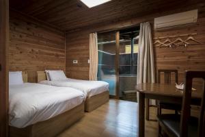 Fujiyama Inn Coniferにあるベッド