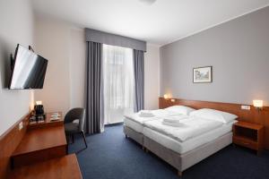 Posteľ alebo postele v izbe v ubytovaní Hotel Beránek