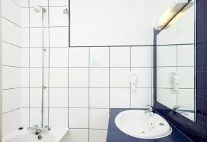 a bathroom with a sink and a mirror at Crossroads by Chef & Brewer Collection in Weedon Bec +41 photos