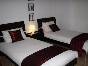 Postel nebo postele na pokoji v ubytování Aphrodite Sands Resort