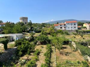 a view of a farm with trees and buildings at The Lovely Loft in Cres