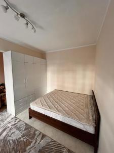 a bedroom with a bed in a room at Apartment City in Tivat