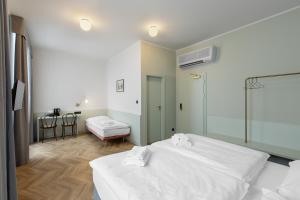 Posteľ alebo postele v izbe v ubytovaní Hotel Beránek