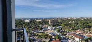 a view of a city from a window at Homely 3-bedroom Apartment at Victoria Place in Dar es Salaam