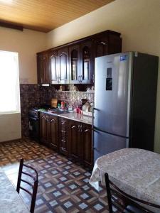 Kuchyň nebo kuchyňský kout v ubytování Tskaltubo Guesthouse Oda