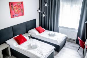 Voodi või voodid majutusasutuse Hotel Gong toas