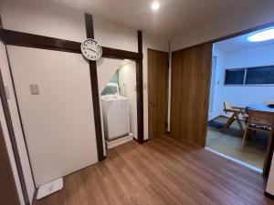 Una cama o camas en una habitación de 关西机场难波梅田直达花園町の夢旅人