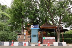 a blue phone booth in front of a building at Heritage Bagan Hotel in Bagan
