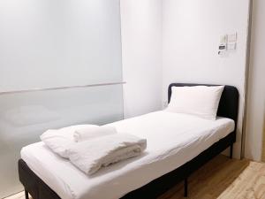 Postel nebo postele na pokoji v ubytování RadZone Hostel