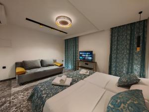 a hotel room with two beds and a couch at Hotel Soldo in Međugorje +132 photos