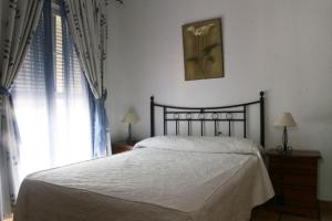 Postel nebo postele na pokoji v ubytování Hotel Restaurante El Duque