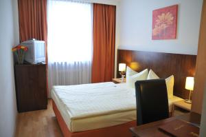 Cama ou camas em um quarto em Hotel Italia