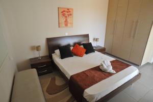 Postel nebo postele na pokoji v ubytování Aphrodite Sands Resort