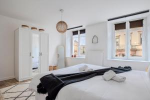 Postel nebo postele na pokoji v ubytování Travel Homes - CityStar - Espace et Confort en plein centre, sur-équipé