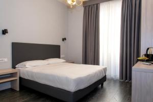 Postel nebo postele na pokoji v ubytování Hotel Philia