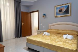 Postel nebo postele na pokoji v ubytování Hotel Philia