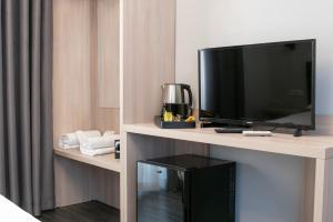 TV a/nebo společenská místnost v ubytování Hotel Philia