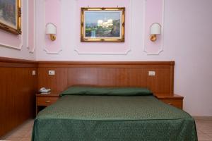 Postel nebo postele na pokoji v ubytování Hotel Philia