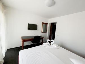 Postel nebo postele na pokoji v ubytování Almaris