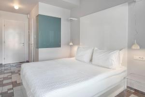 Postel nebo postele na pokoji v ubytování SESA Boutique Hotel & Restaurant