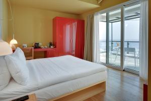 Postel nebo postele na pokoji v ubytování SESA Boutique Hotel & Restaurant